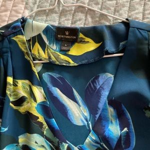 Short sleeve multi colored blouse in jewel tones.